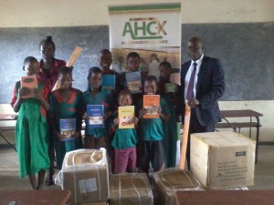 All smiles: Sakwi Primary School pupils display some of the donated items